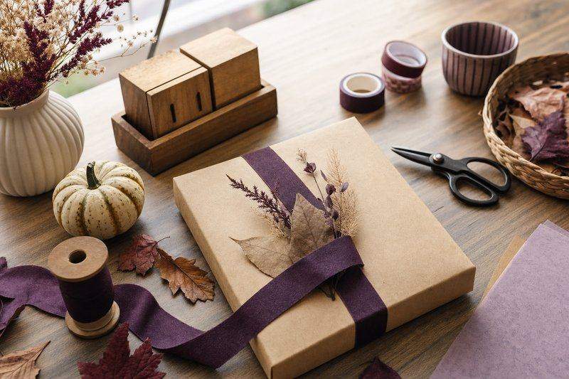 A small desk calendar beside seasonal craft supplies — AI-generated image